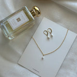 Necklace displayed on Laondrim brand card with earrings