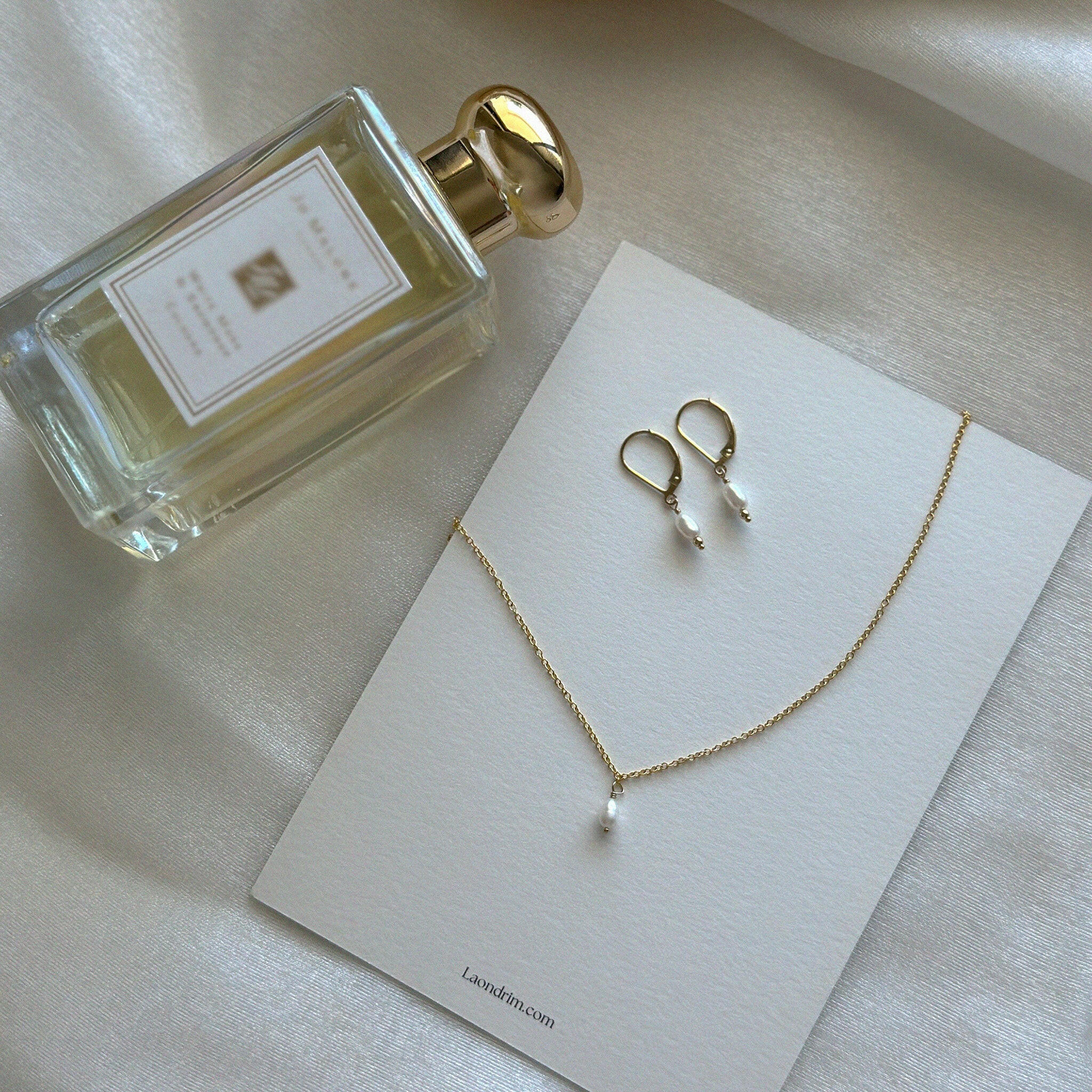 Necklace displayed on Laondrim brand card with earrings