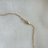 Side angle of lobster clasp and upper chain connection