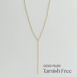 Gold filled necklace on a light gray background with 'Tarnish Free' text.