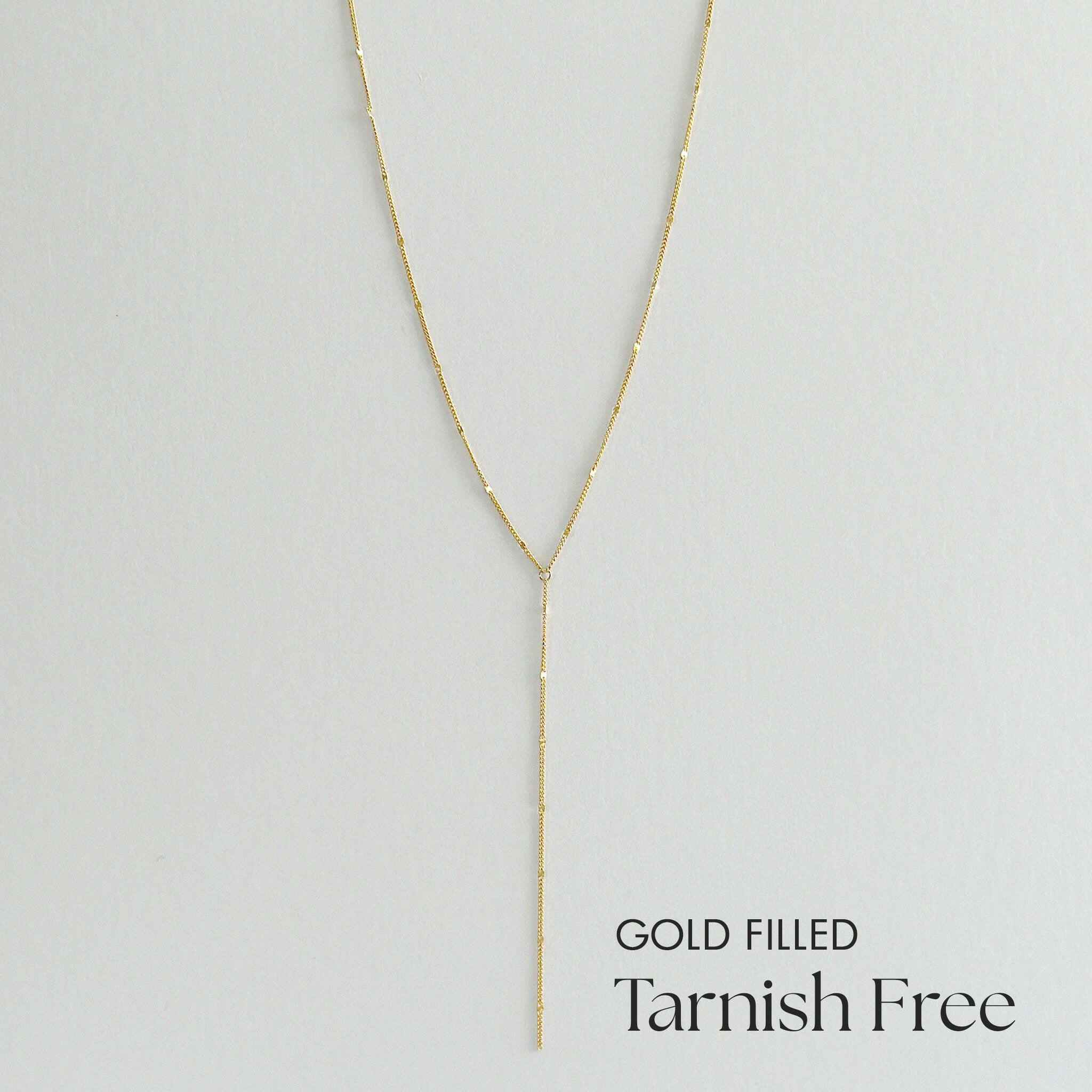 Gold filled necklace on a light gray background with 'Tarnish Free' text.