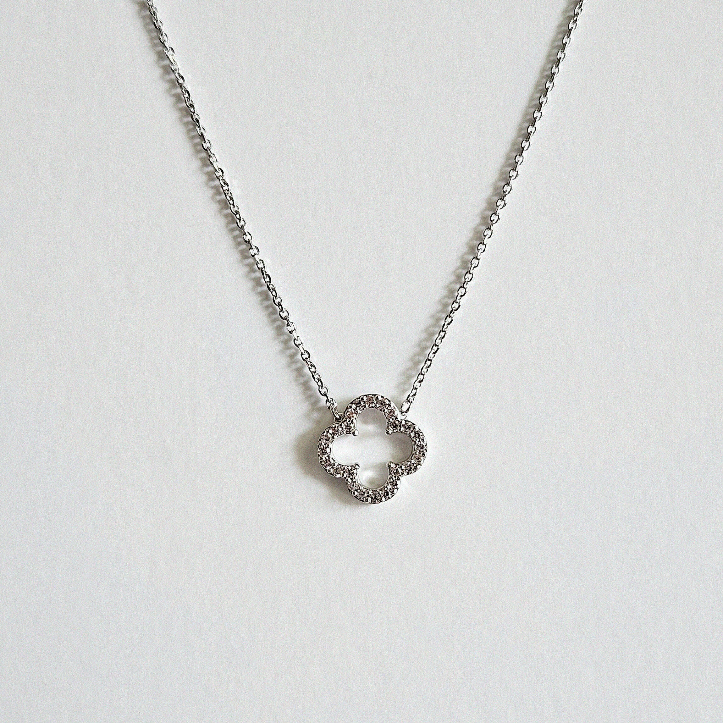 Zoomed-in image of pendant highlighting four-leaf clover shape and shine