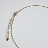 Close-up of clasp and adjustable chain on gold-plated version