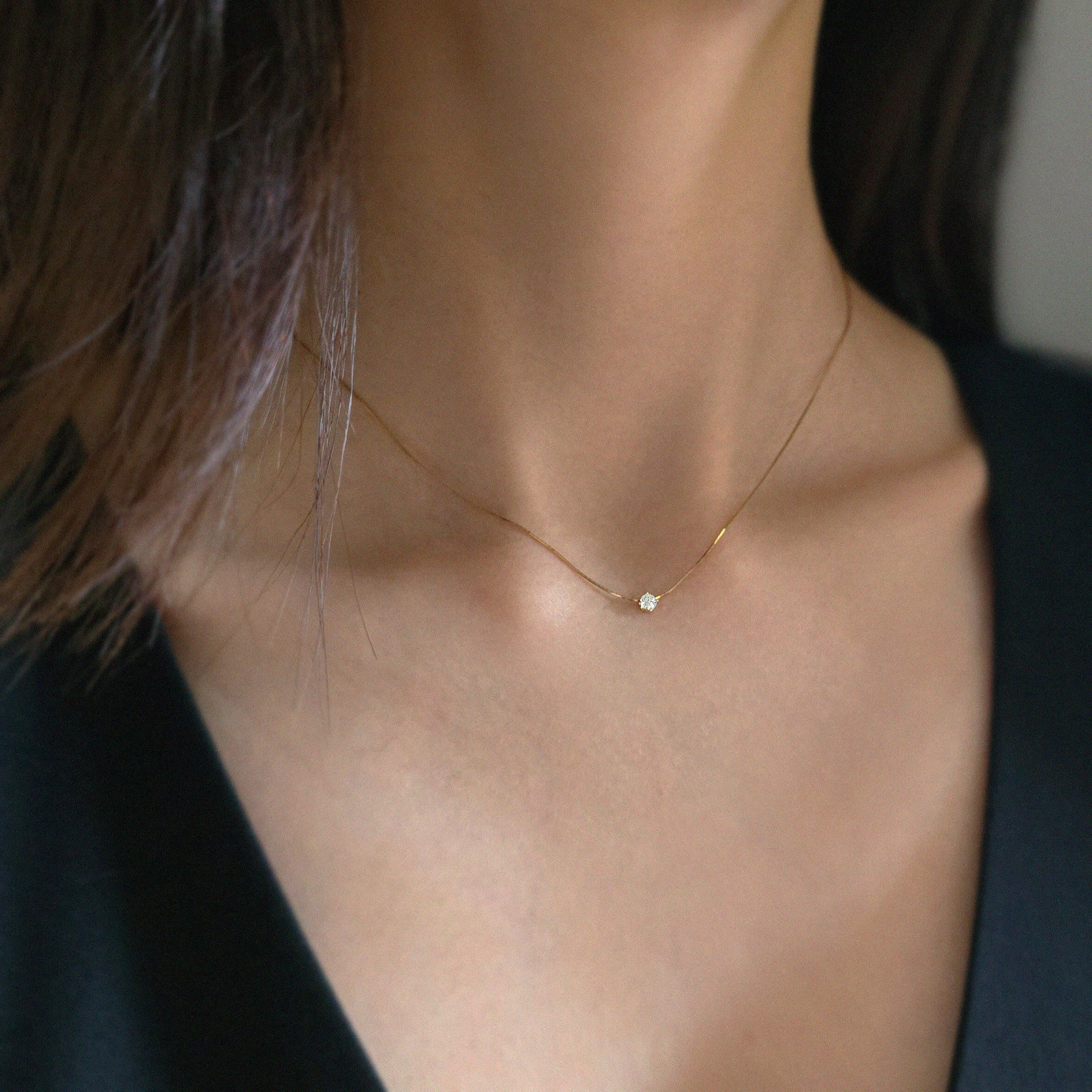 Side profile of necklace styled solo for minimalist look