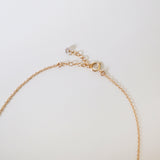 Side view showing spring ring clasp and chain connection