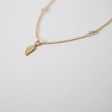 Close-up of leaf pendant texture and moonstone shimmer