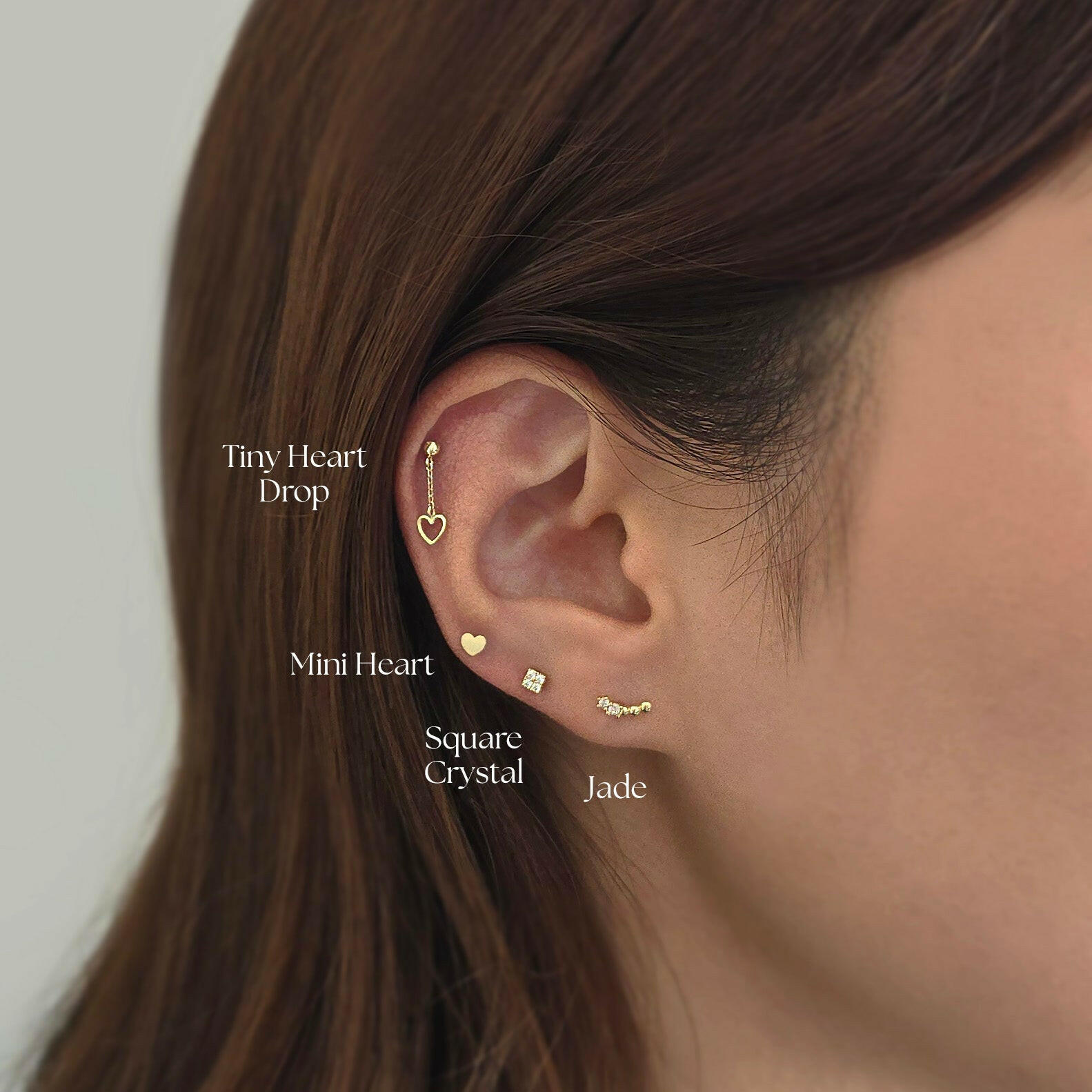 Jade Cartilage Earring stacked with multiple gold studs and cartilage in curated ear styling