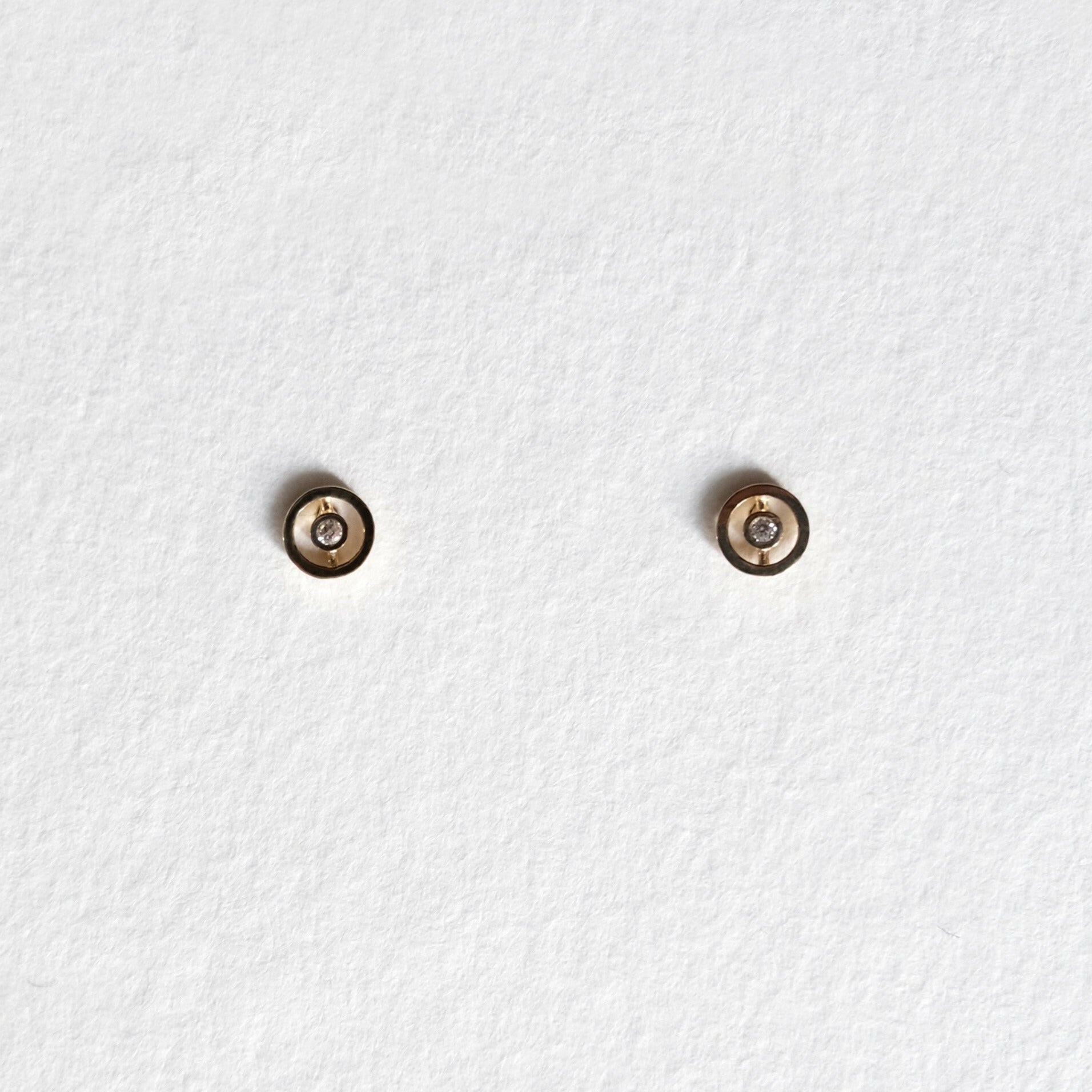 Front view of Bishop Circle Studs with centered CZ in 10K gold