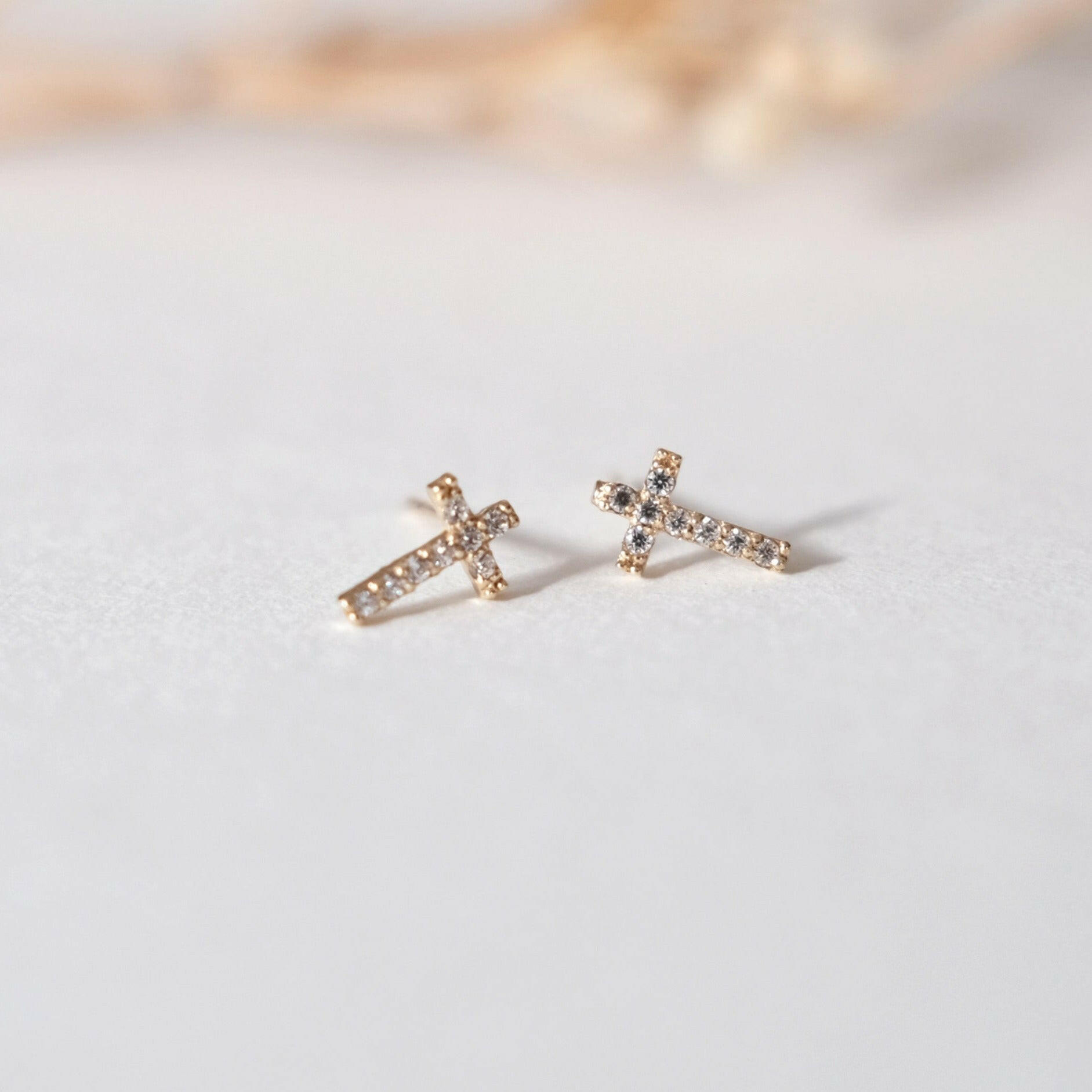 Minimalist cross earrings in 10K gold with clean structure