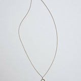 Calla Necklace laid flat in full length to display chain structure and balance