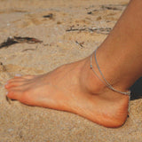Elegant anklet featuring a dual chain design for a sophisticated layered look, perfect jewelry accessory
