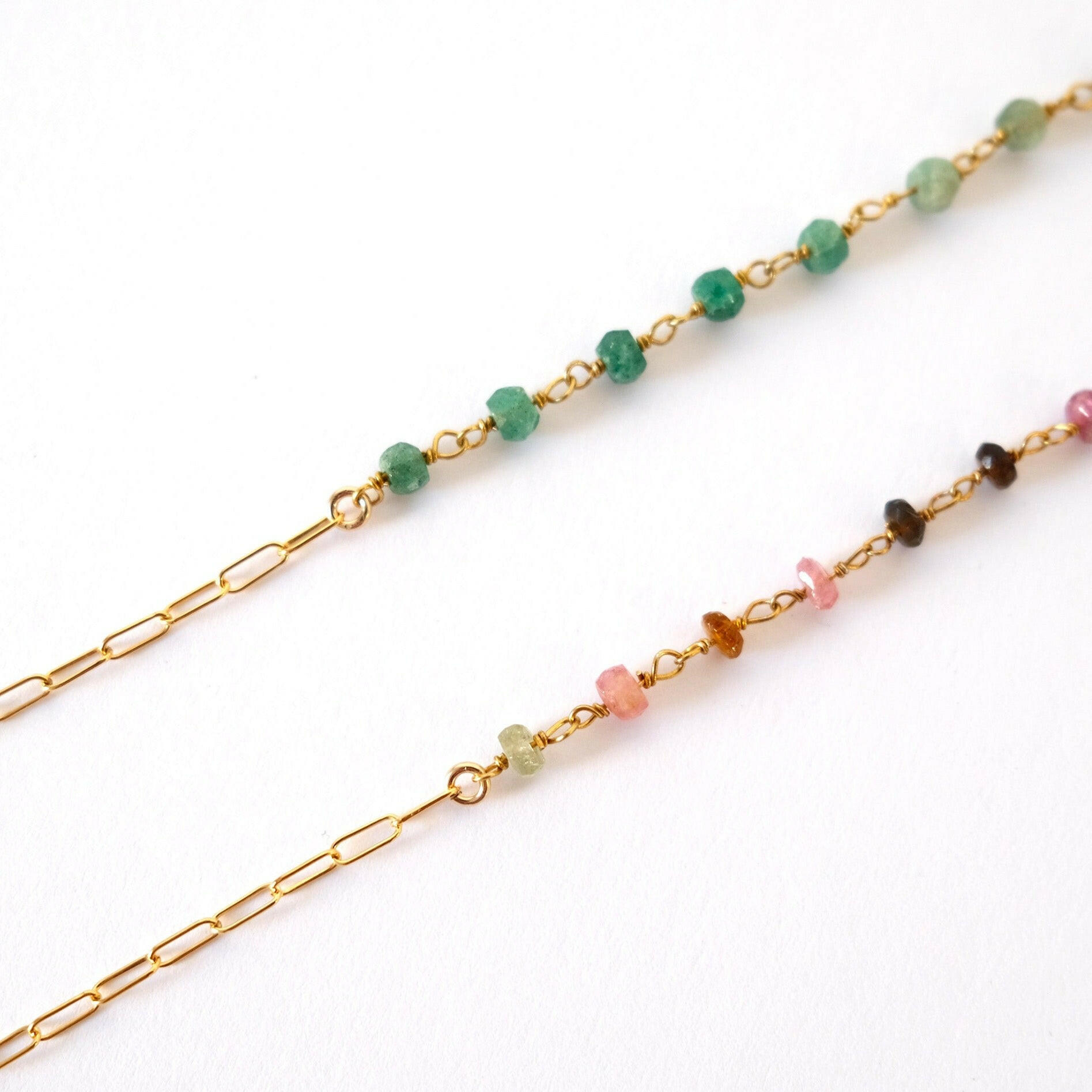 Gold Filled Aria Tourmaline Bracelet and Gold Filled Aria Aventurine Bracelet displayed on the white background
