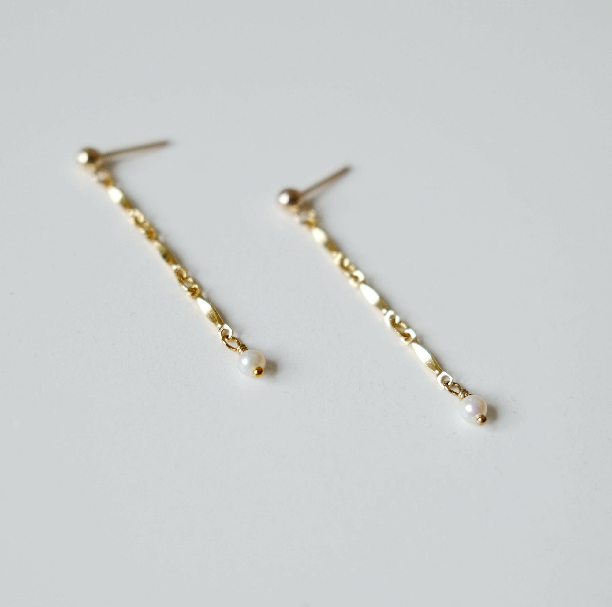 Side profile of Lydia Chain With Pearl Earrings highlighting the length and pearl details
