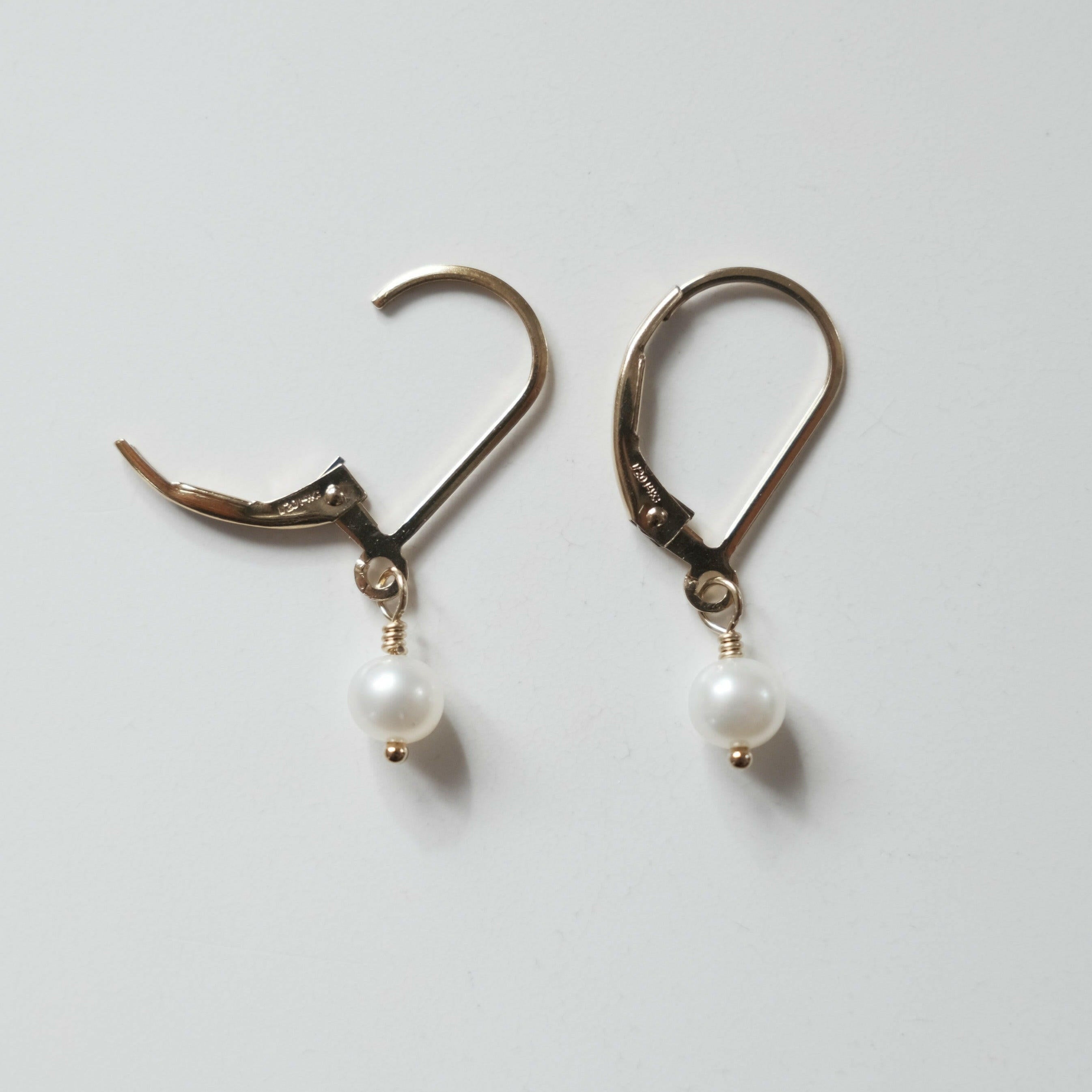 Close-up of Olivia Pearl Earring showing two of mideum pearl and smooth finish