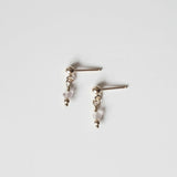 Petite gold drop earrings with small round clear quartz gemstones and gold posts