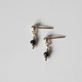 Petite gold drop earrings with small round black spinel gemstones and gold posts