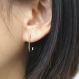 Minimal chic earrings featuring sleek J shaped line for a modern design enhancing elegance and style.