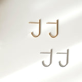 Minimal chic earrings featuring sleek J shaped line for a modern design enhancing elegance and style.