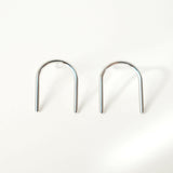 Arch earrings featuring a minimalist line design, sleek and shiny arch line, capturing chic and minimalist style