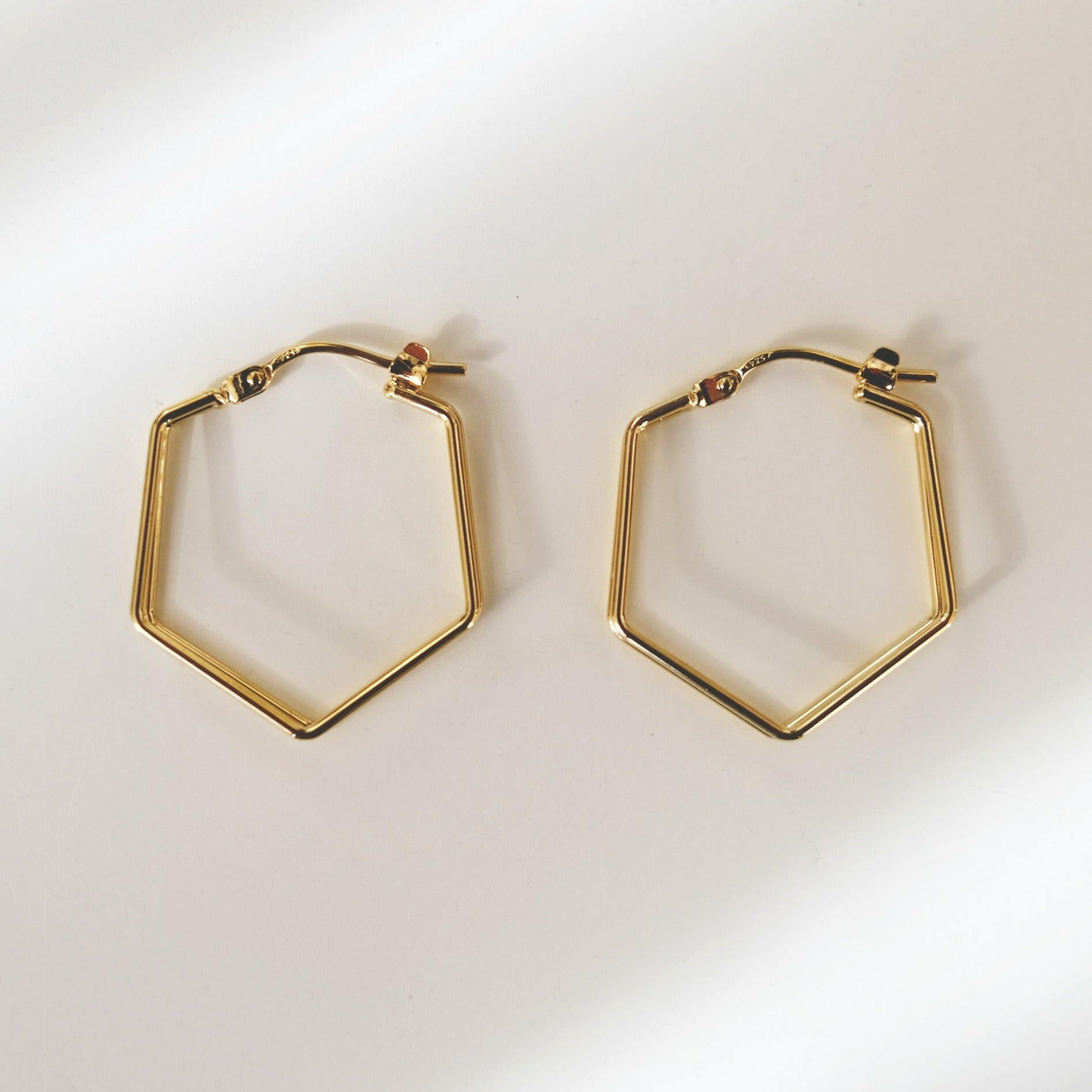 Modern chic hexagon dual lined hoops with simple elegant design, perfect for minimalist style and contemporary fashion.