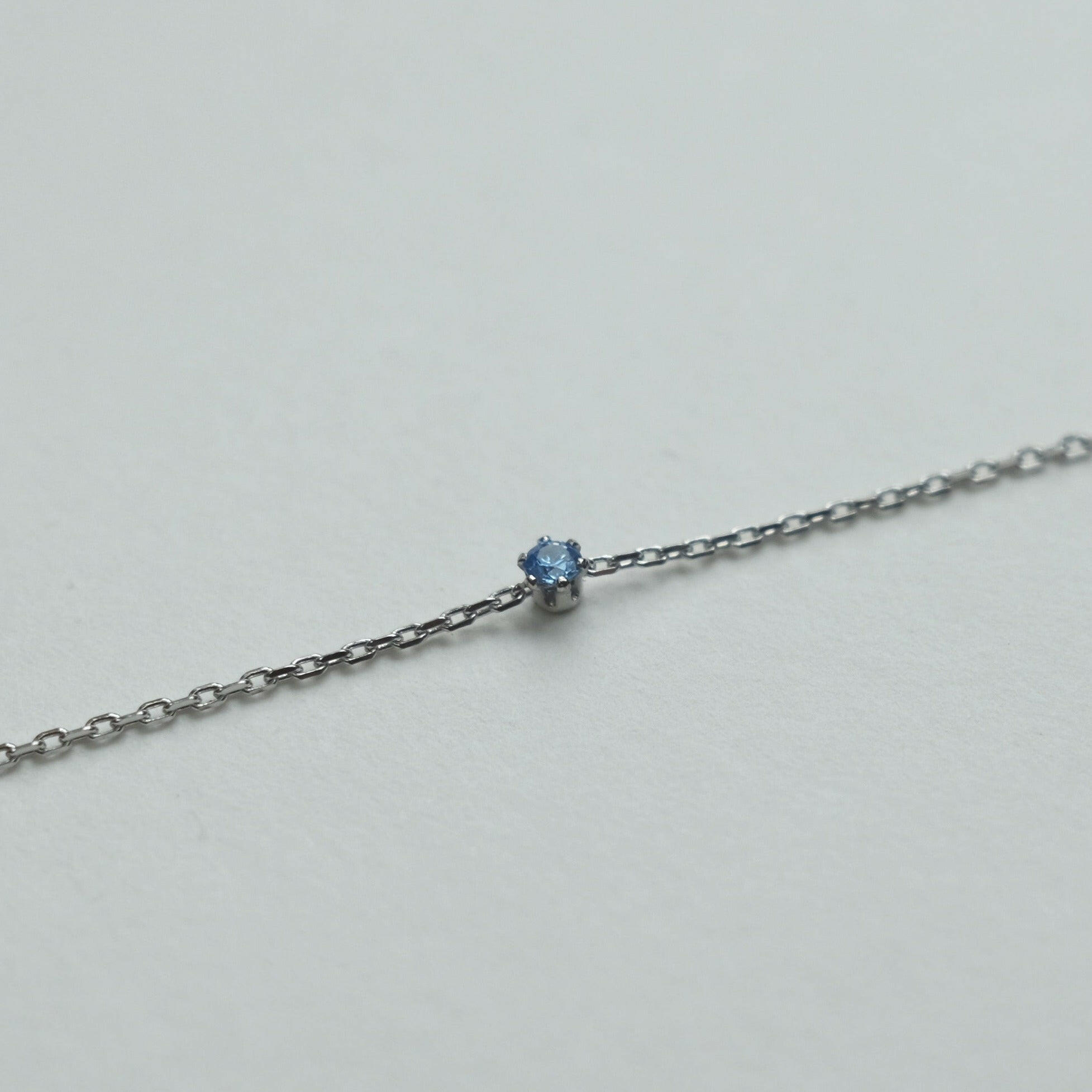 Petite crystal bracelet featuring a delicate stone and fine chain, perfect for elegant jewelry collections.