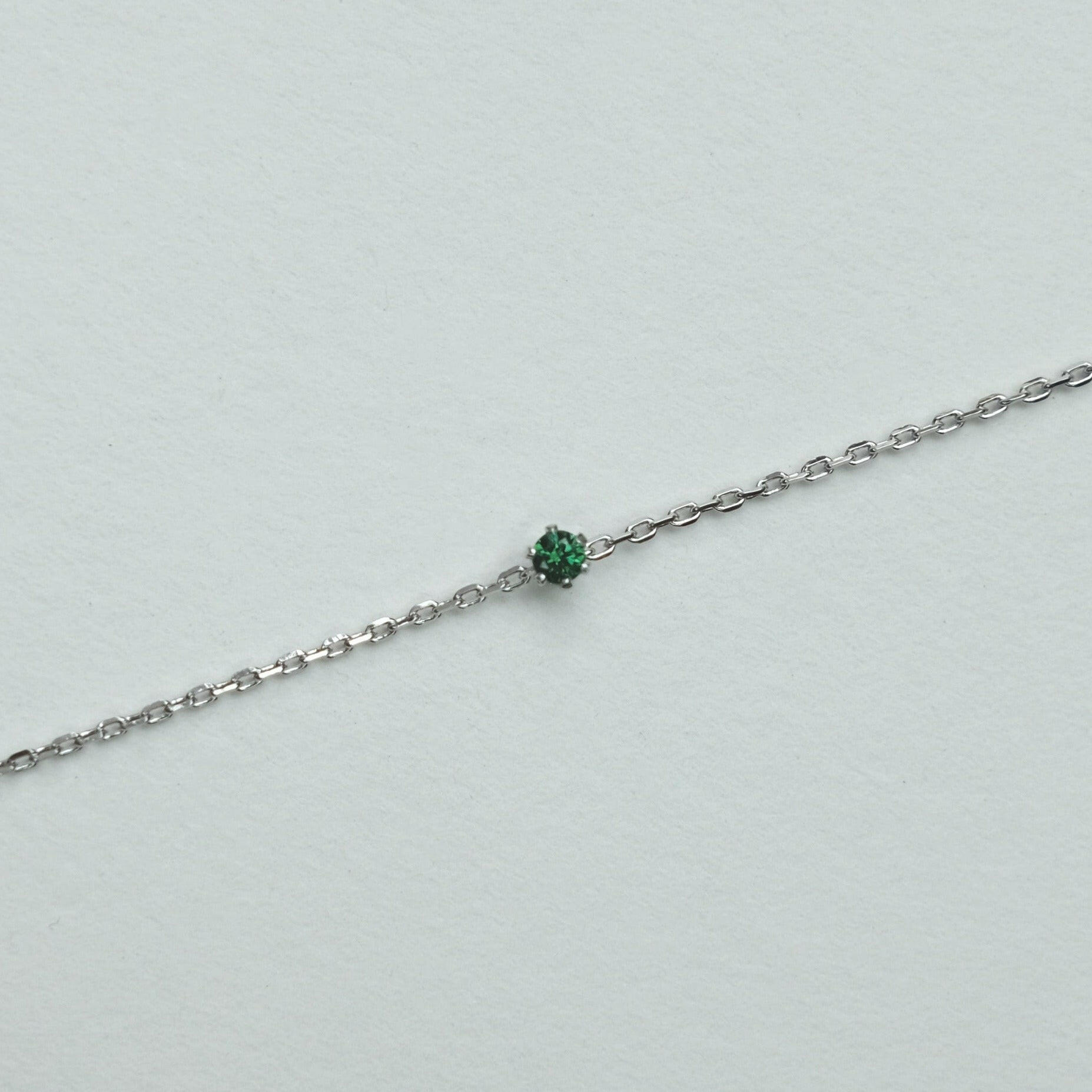 Petite crystal bracelet featuring a delicate stone and fine chain, perfect for elegant jewelry collections.