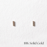 Front view of 10K Petite CZ Line Studs with slim gold bar design