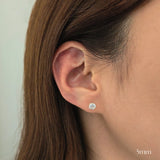 Model wearing 5mm crystal stud earrings for a minimal and chic look.