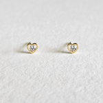 Mini heart gold studs with crystal sparkle photographed from front