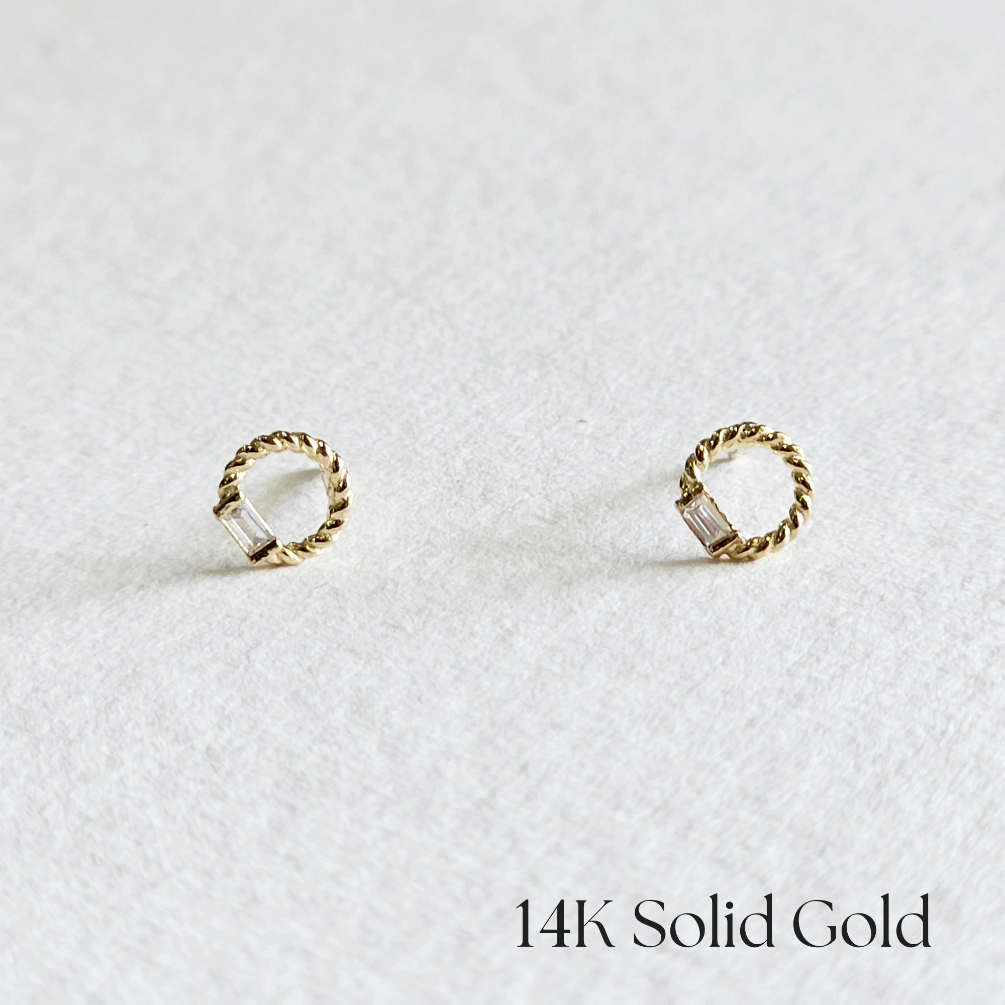 Front view of 14K Jennie earrings with twisted gold frame and cubic zirconia