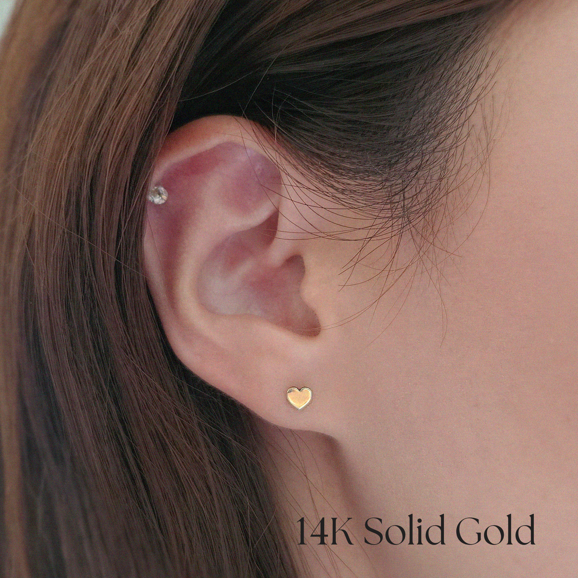 Model wearing Mini Heart Studs for a cute and minimal look