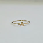 Front view of 14K Initial Ring with diamond accent and polished gold finish
