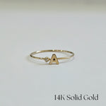 Front view of 14K Initial Ring with diamond accent and polished gold finish