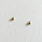 Sculpted gold teardrop earrings viewed from an angle