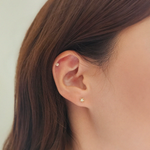 Model wearing Shining Star earrings for celestial-inspired elegance