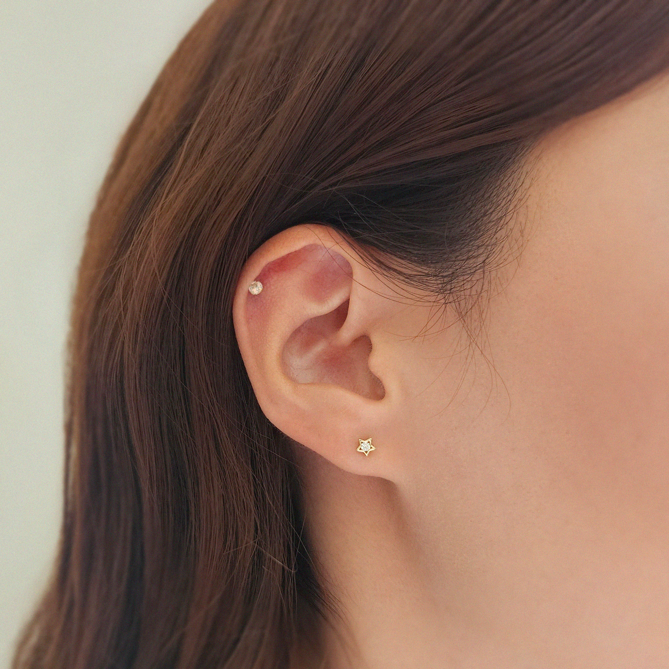 Model wearing Shining Star earrings for celestial-inspired elegance