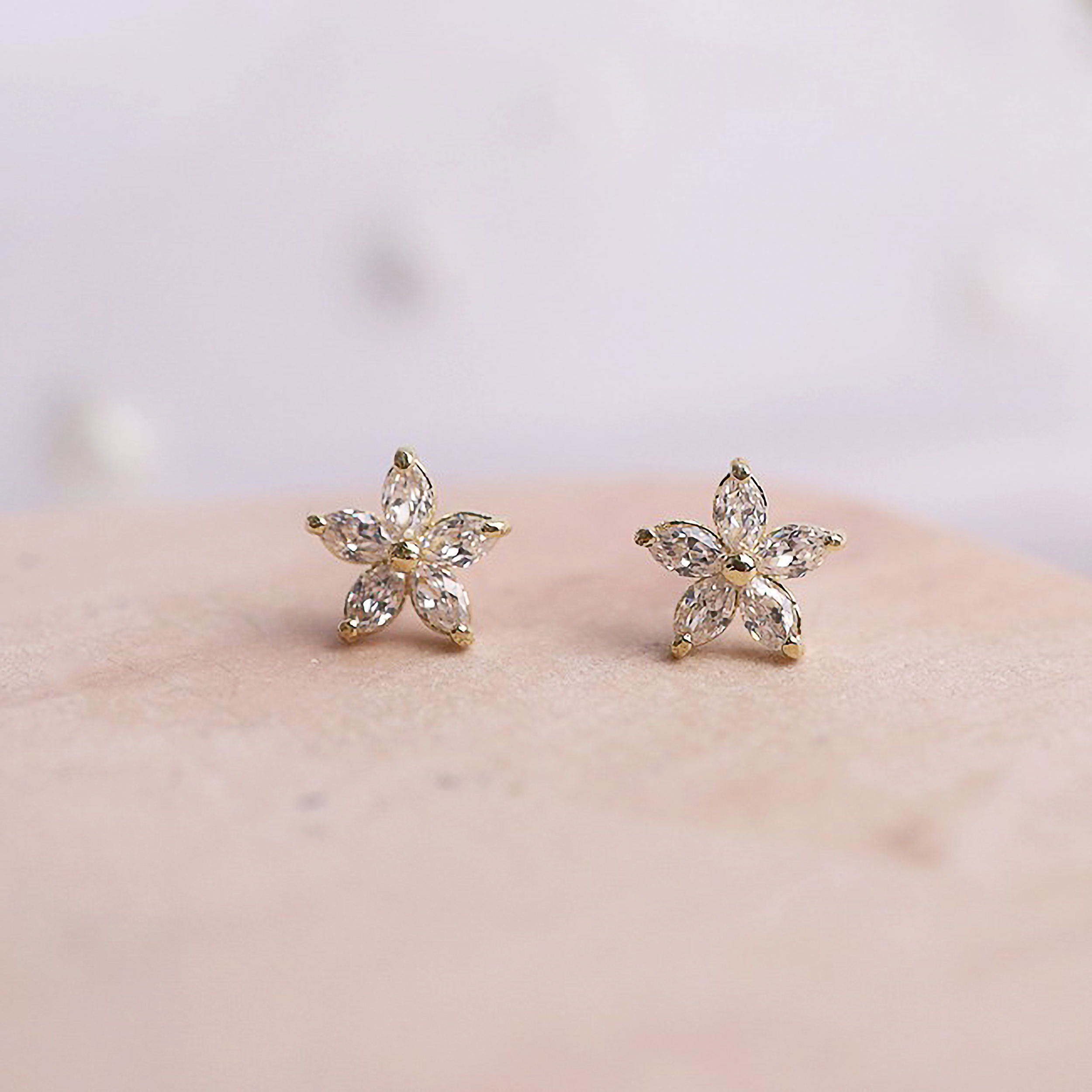 Gold floral earrings with brilliant cubic zirconia detail