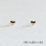 Front view of voluminous heart-shaped 14K gold stud earrings