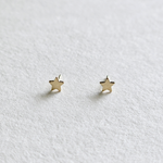 Front view of 14K Tiny Star Studs with classic star shape in polished gold