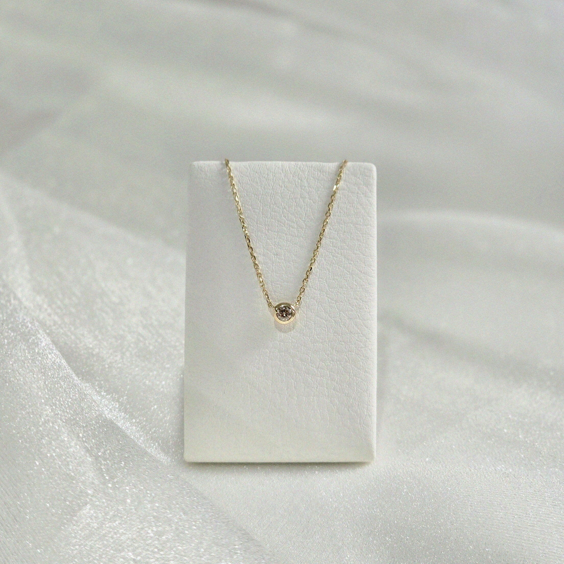 Diamond Accent Necklace displayed on velvet necklace stand – showing pendant placement and drape