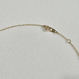 Detailed view of spring ring clasp and extender chain – 14K gold components with high polish finish