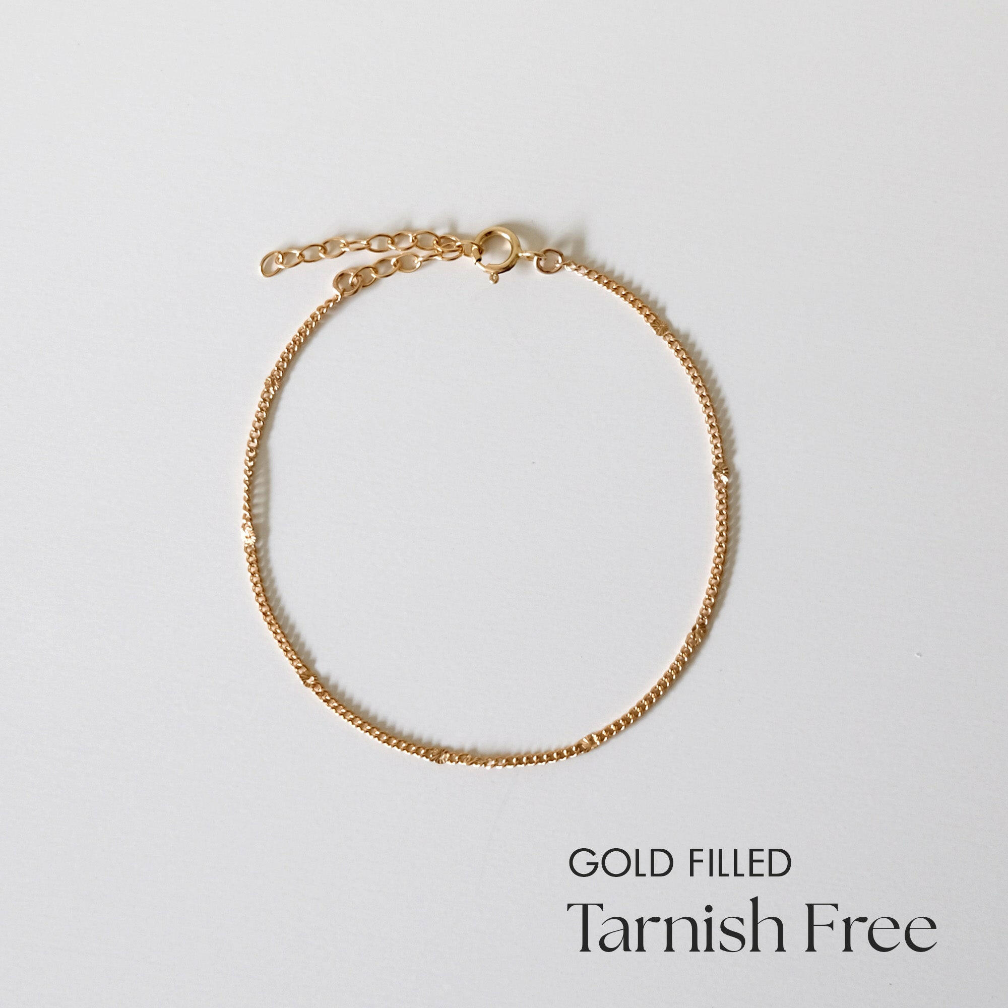 Flat lay of The Ally Chain Bracelet showing full length and extension