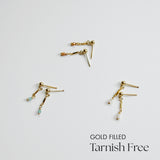 Gold-filled earrings on a light gray background with 'Gold Filled Tarnish Free' text.