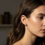 Close-up of a woman wearing earrings with a blurred background