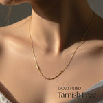 Gold filled necklace on a model with 'GOLD FILLED Tarnish Free' text.