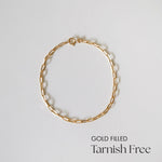 Flat lay of Gold Filled 45243 Link Chain Bracelet showcasing elongated oval links