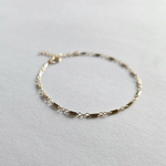 Macro shot showing textured chain links of Bonbon Bracelet