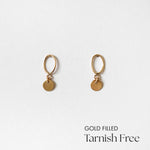 Front view of Celina Disc Earrings showing polished circular charms