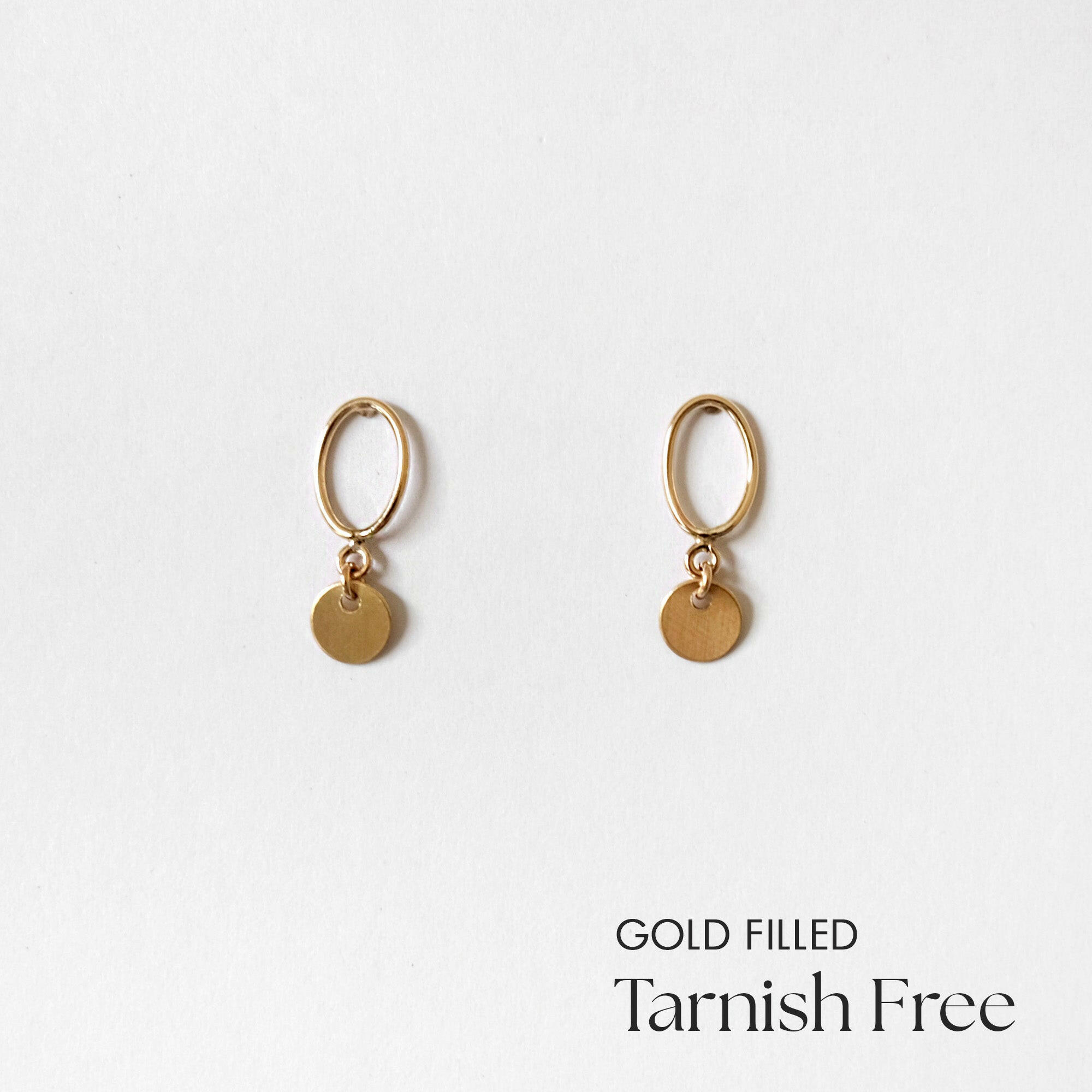 Front view of Celina Disc Earrings showing polished circular charms