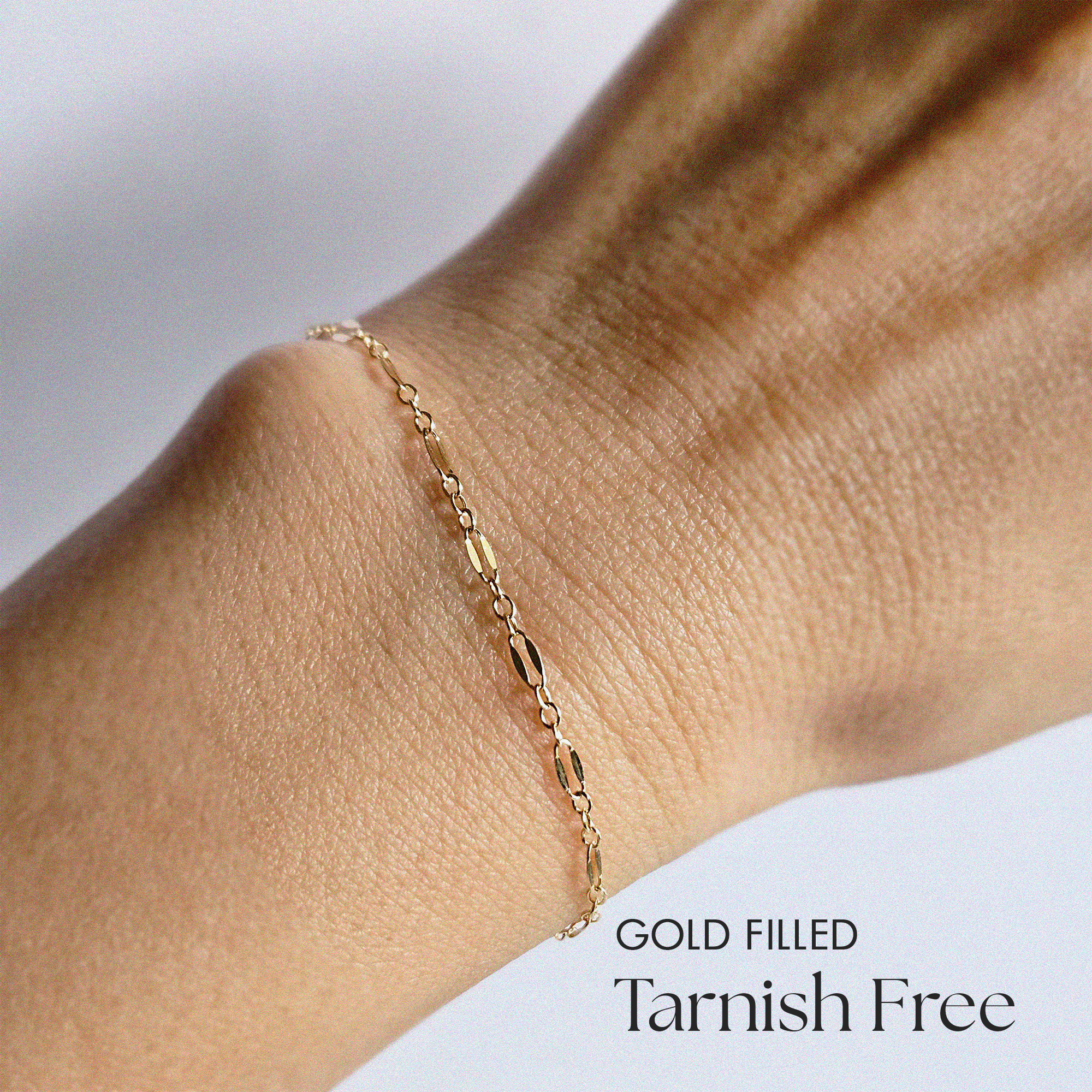 Model wearing Coffee Bean Bracelet with top view showcasing bold chain